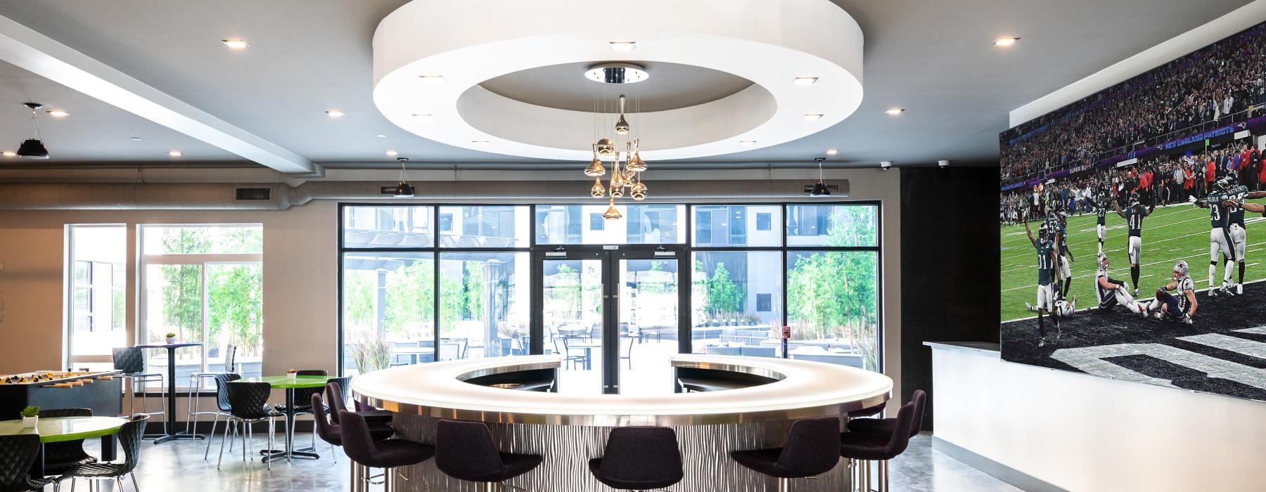 a room with tv tables and chairs